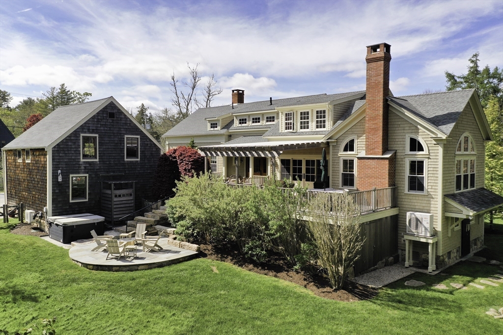 a front view of a house with a garden and plants