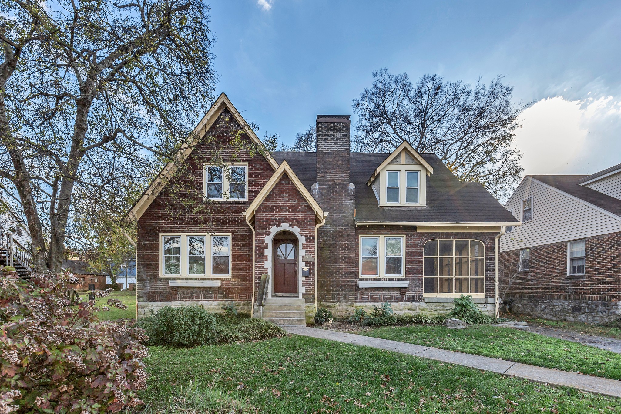 front view of a house with a yard