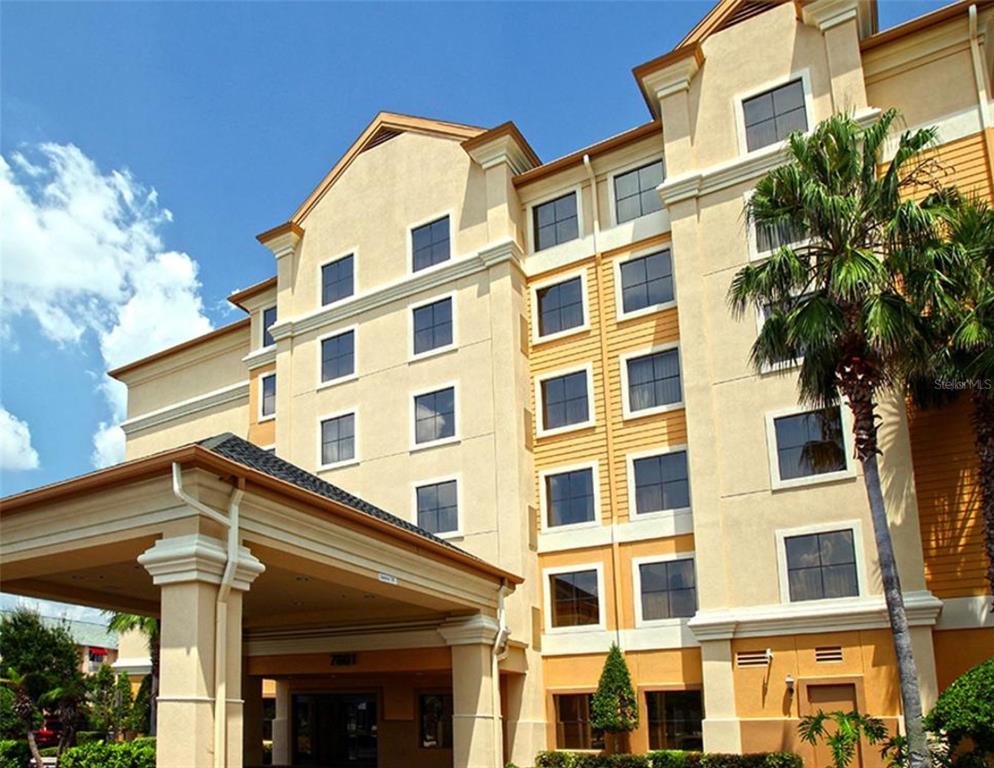 a view of a building with a tree