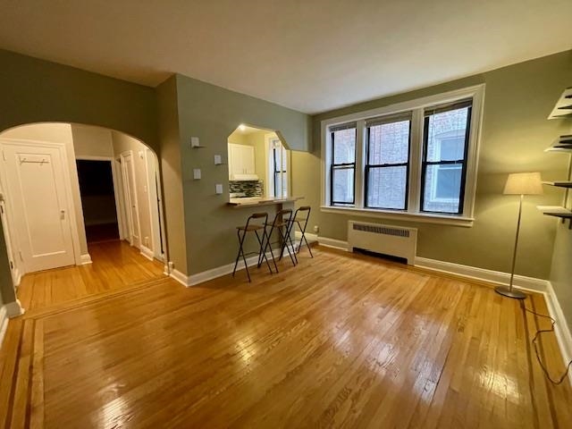 a view of a livingroom with furniture and an empty room