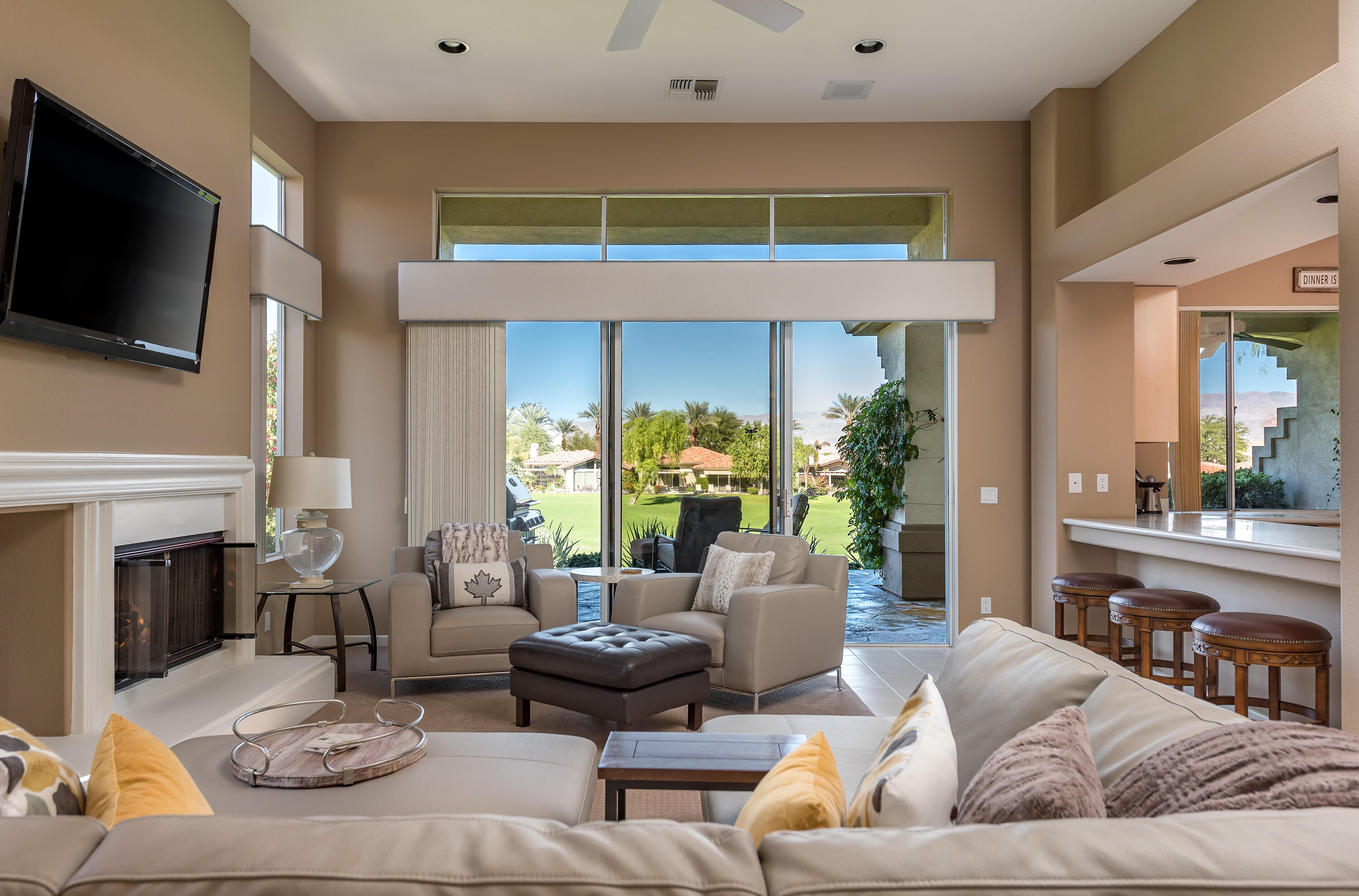 a living room with fireplace furniture and a flat screen tv