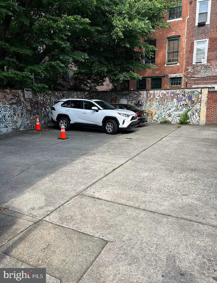 a front view of a house with parking