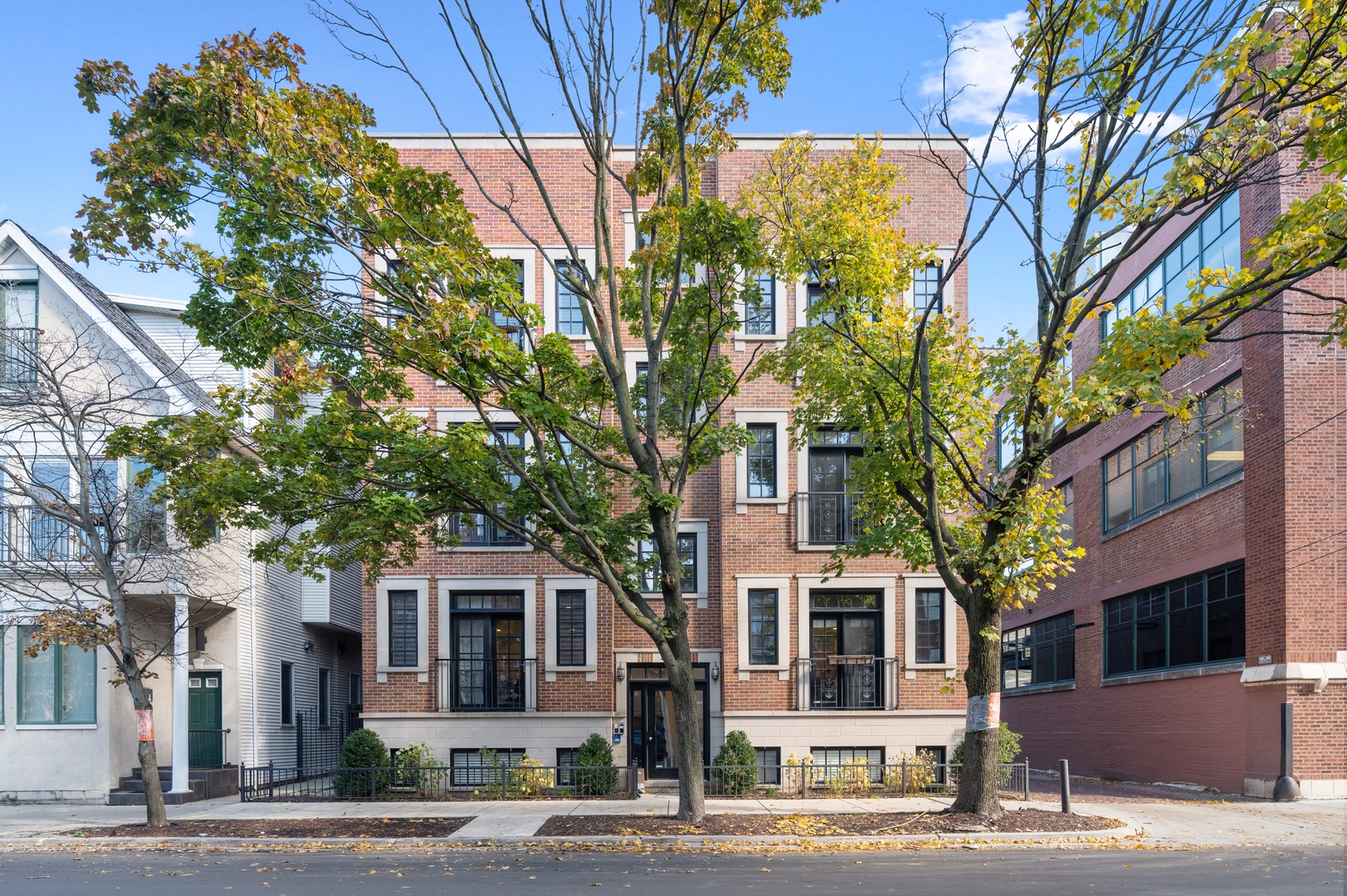 a front view of a multi story residential apartment buildings