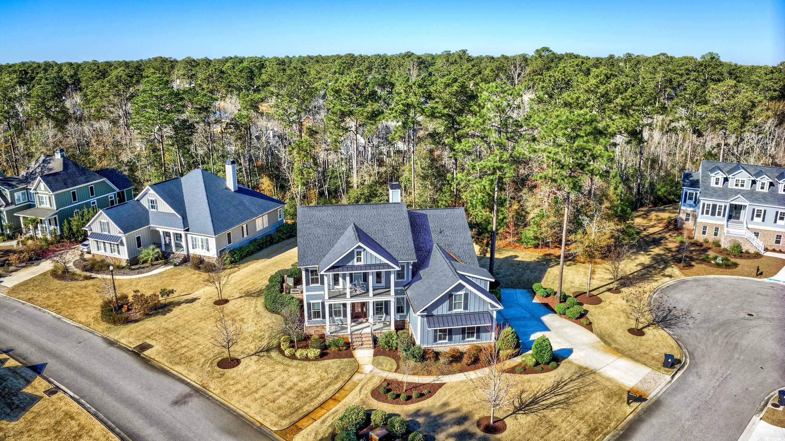 Birds eye view of property to the right and behind