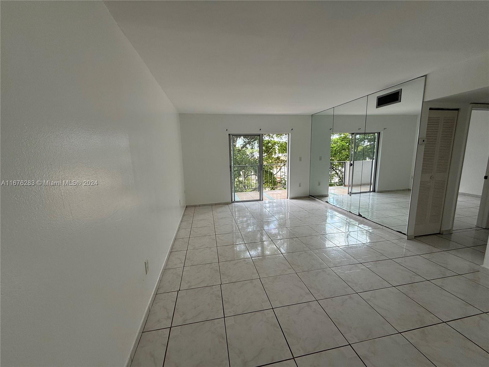 a view of an empty room and window