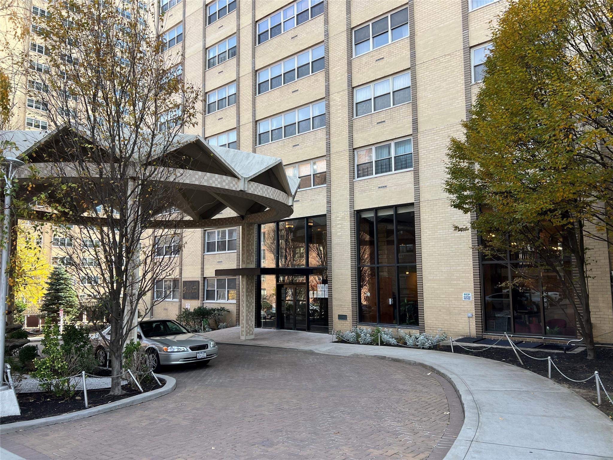 a view of a building with sitting area