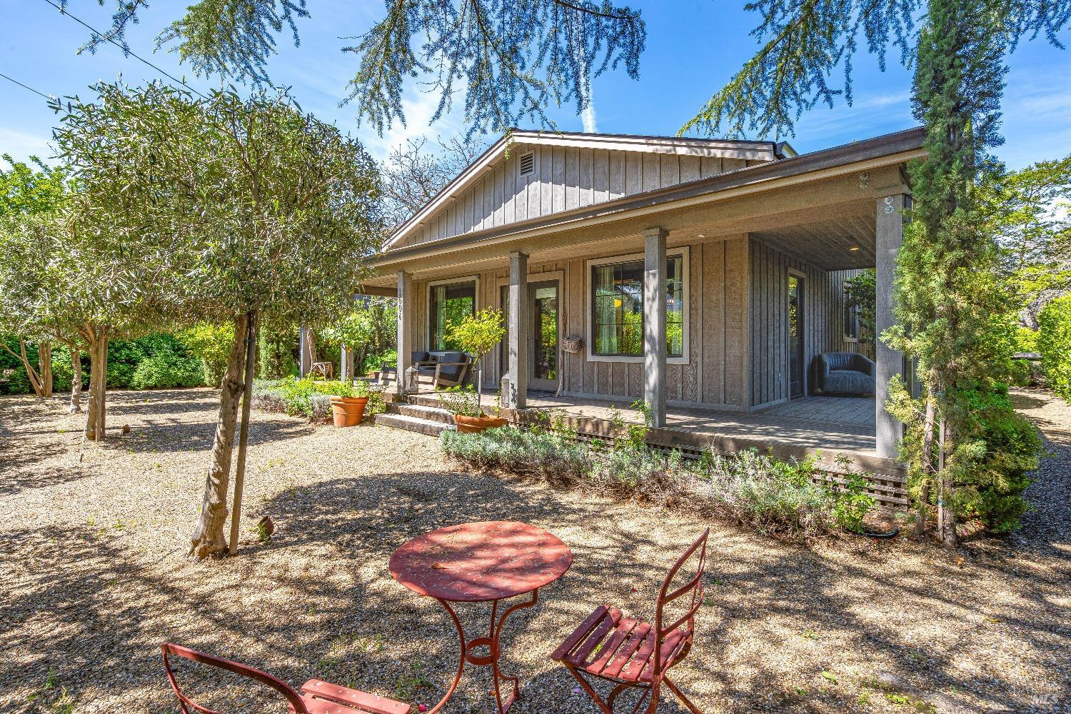 a front view of a house with garden