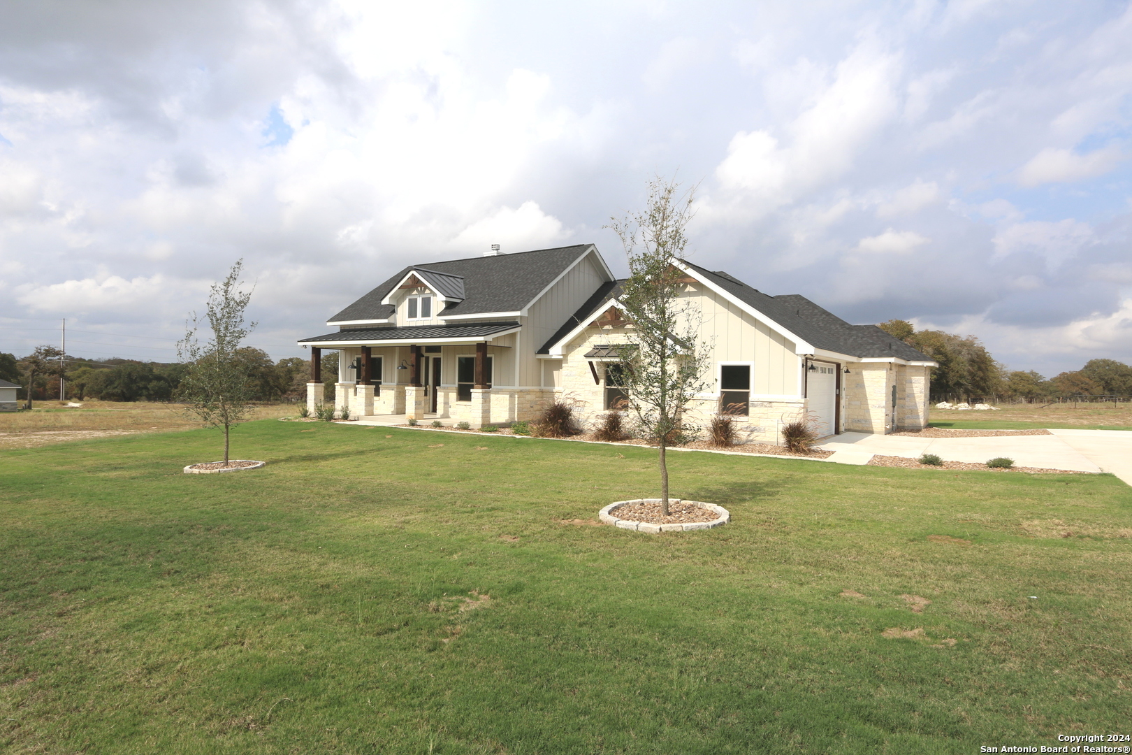 a front view of house with outdoor space and swimming pool