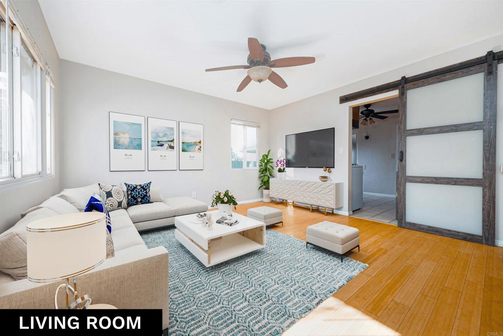 a living room with furniture and a flat screen tv