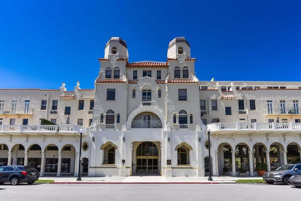 a large building with a clock on the wall