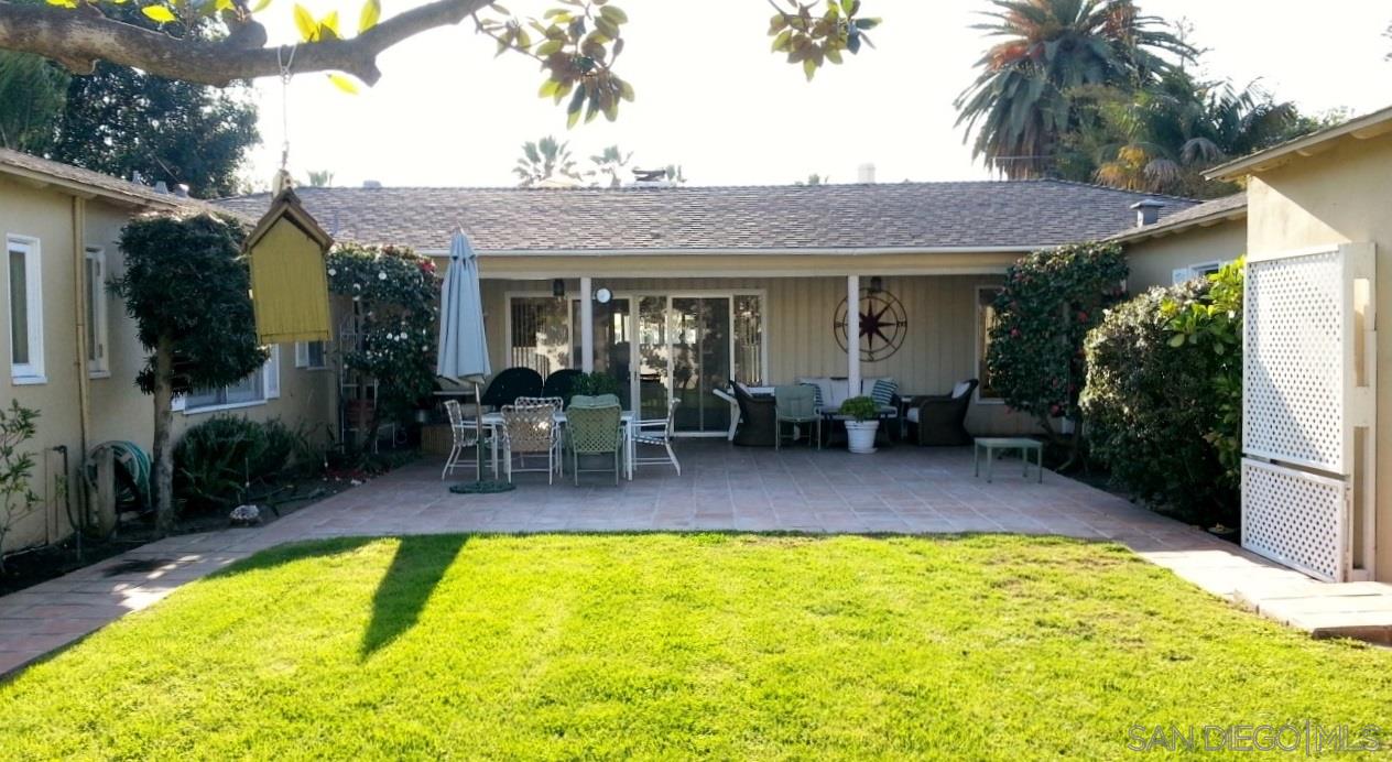 a view of a patio with swimming pool table and chairs