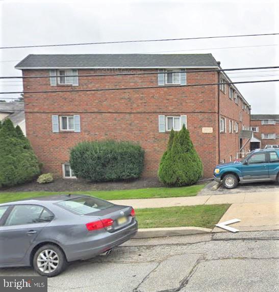 a view of a car parked in front of a house