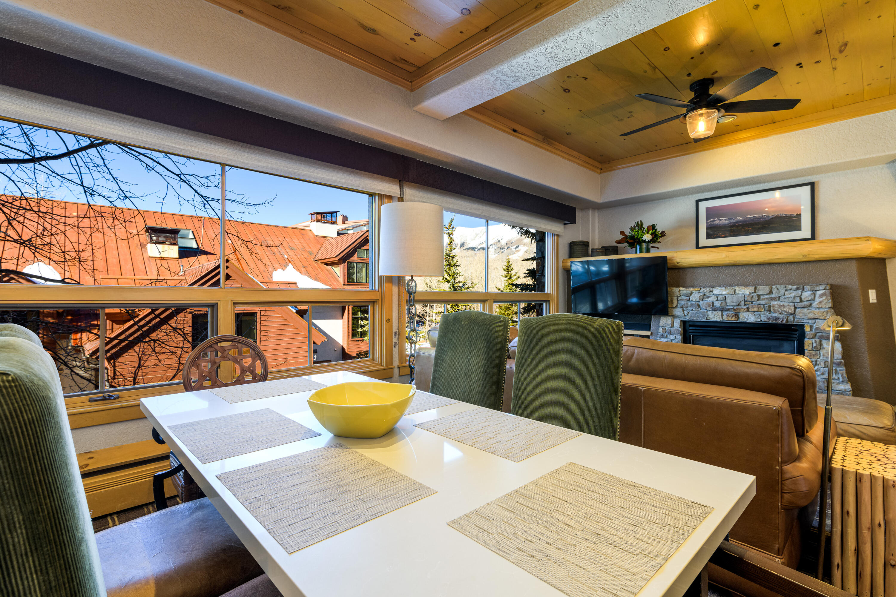 a view of a dining room with furniture a chandelier and wooden floor