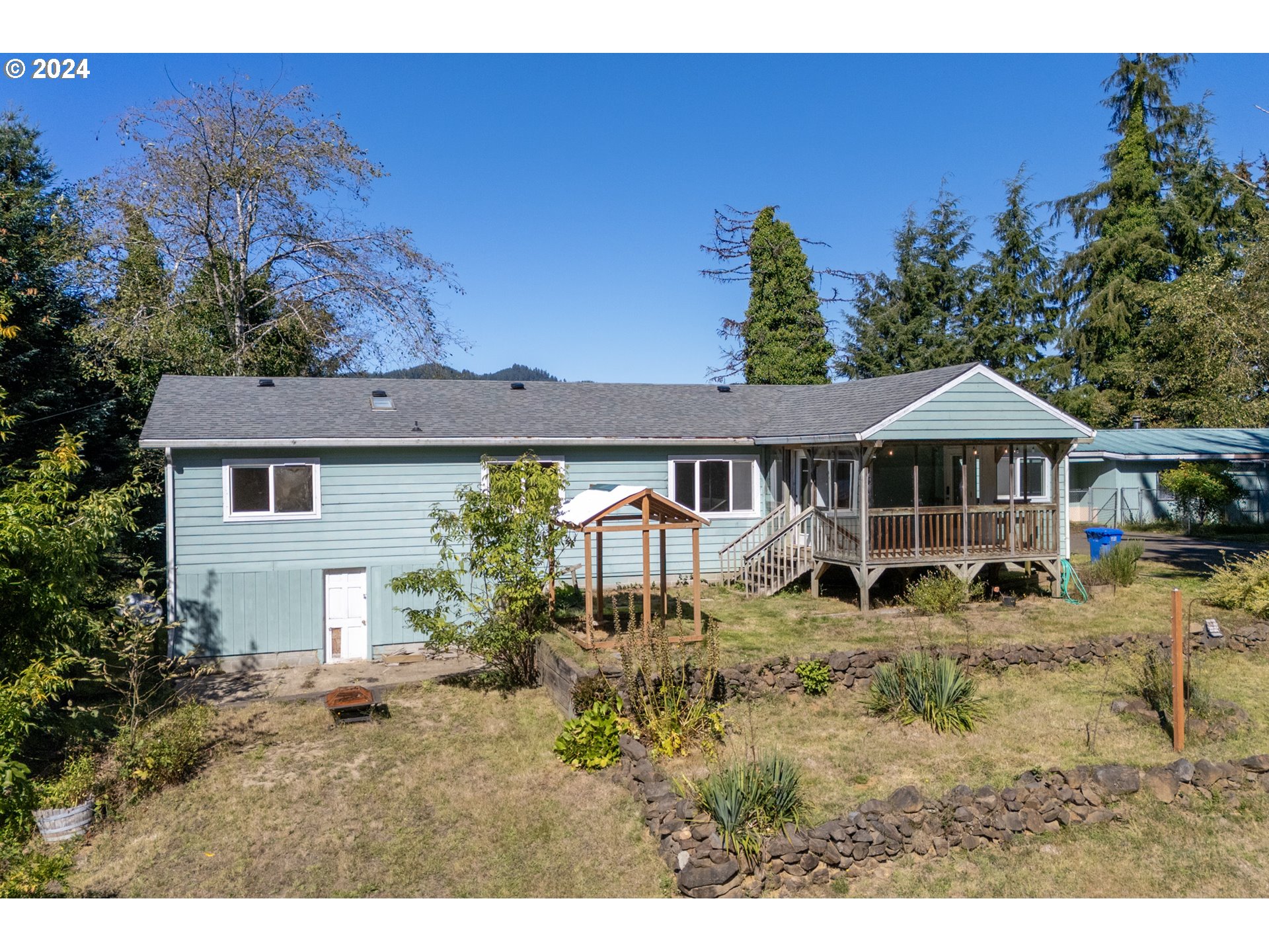 a house with trees in the background