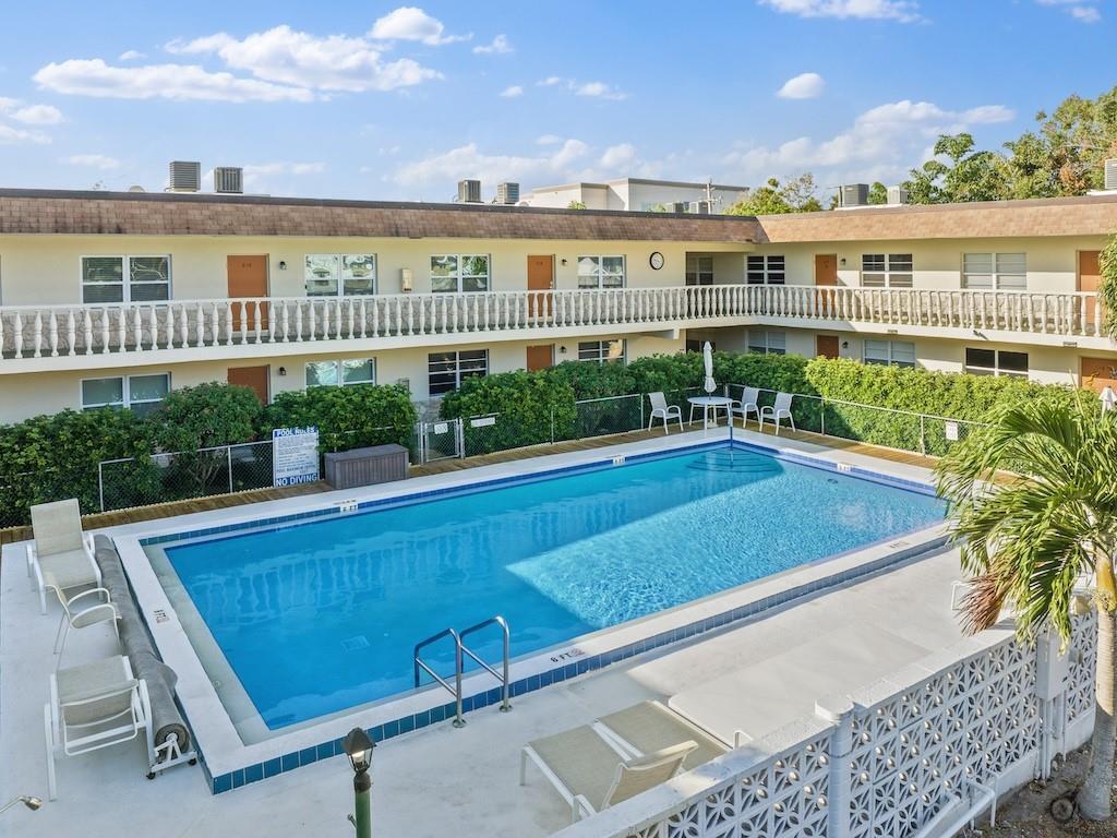 a view of a swimming pool with a patio