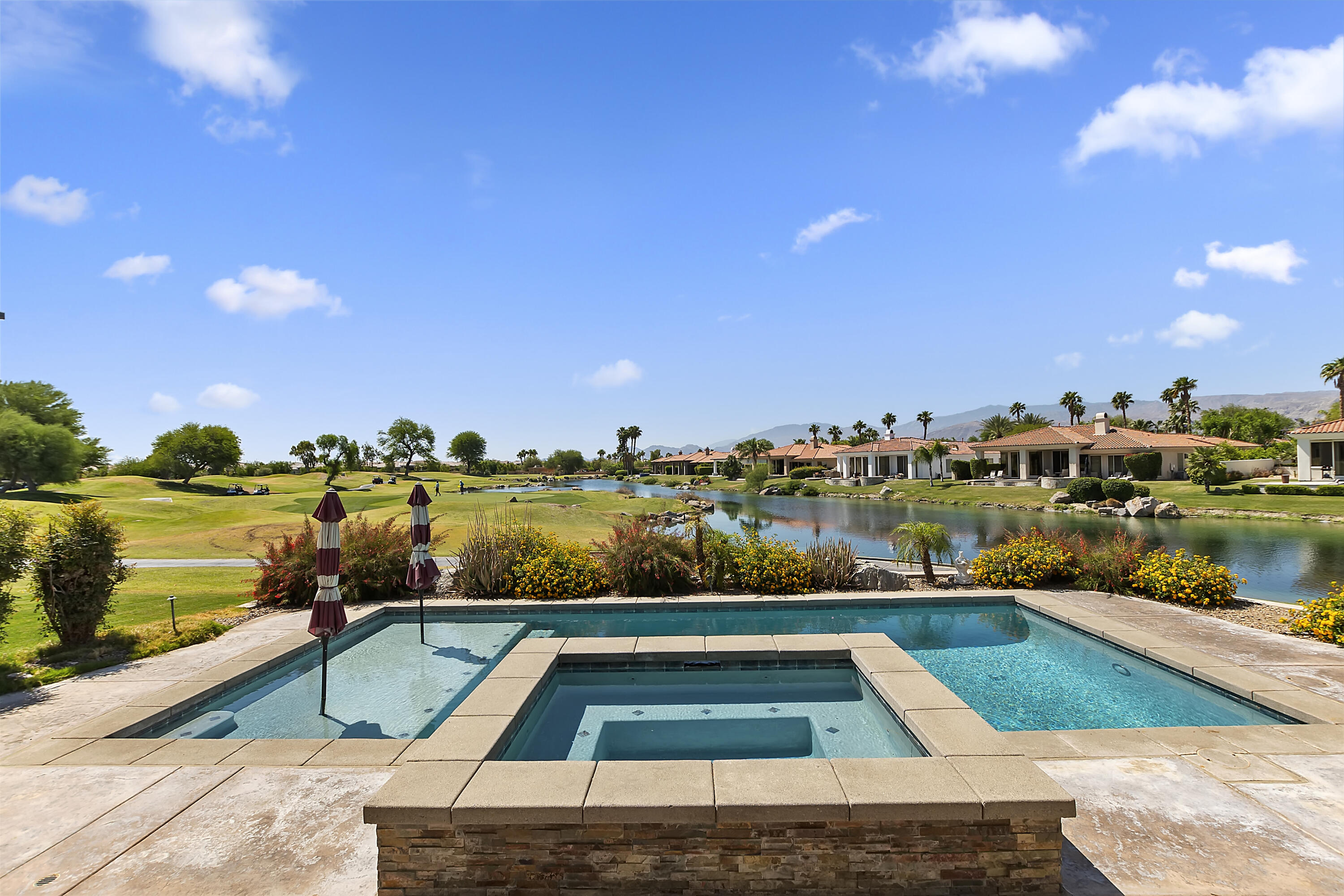 a view of swimming pool from a balcony