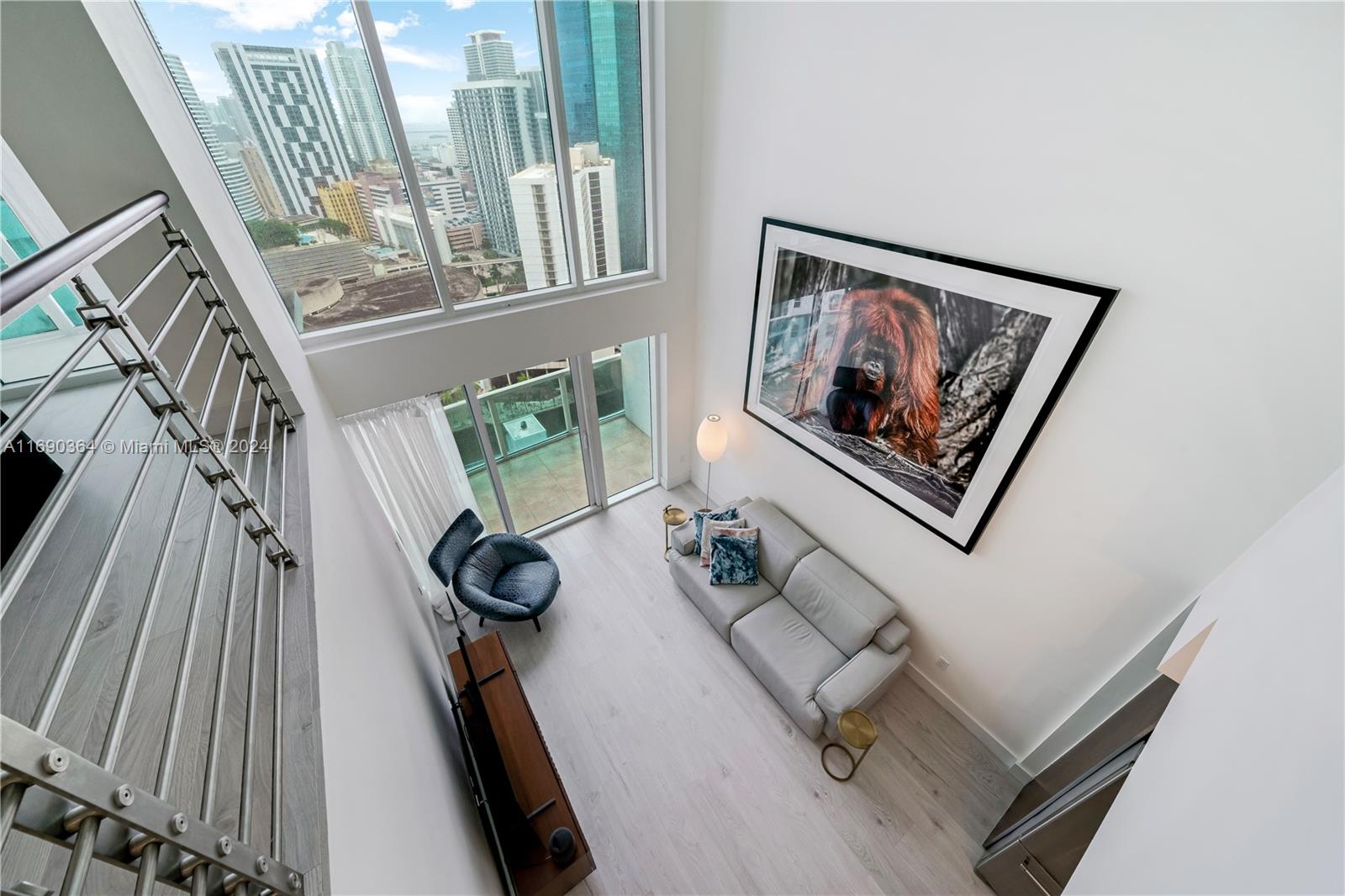 a view of staircase with wooden floor and livingroom view