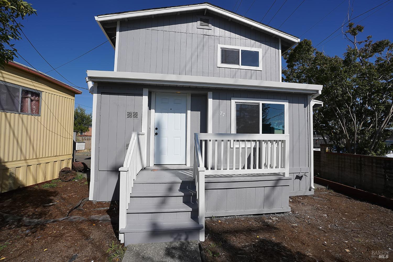 a front view of a house with a fence