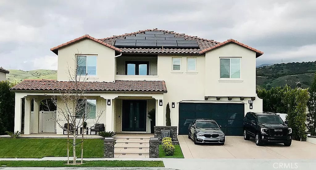 a house view with a garden space