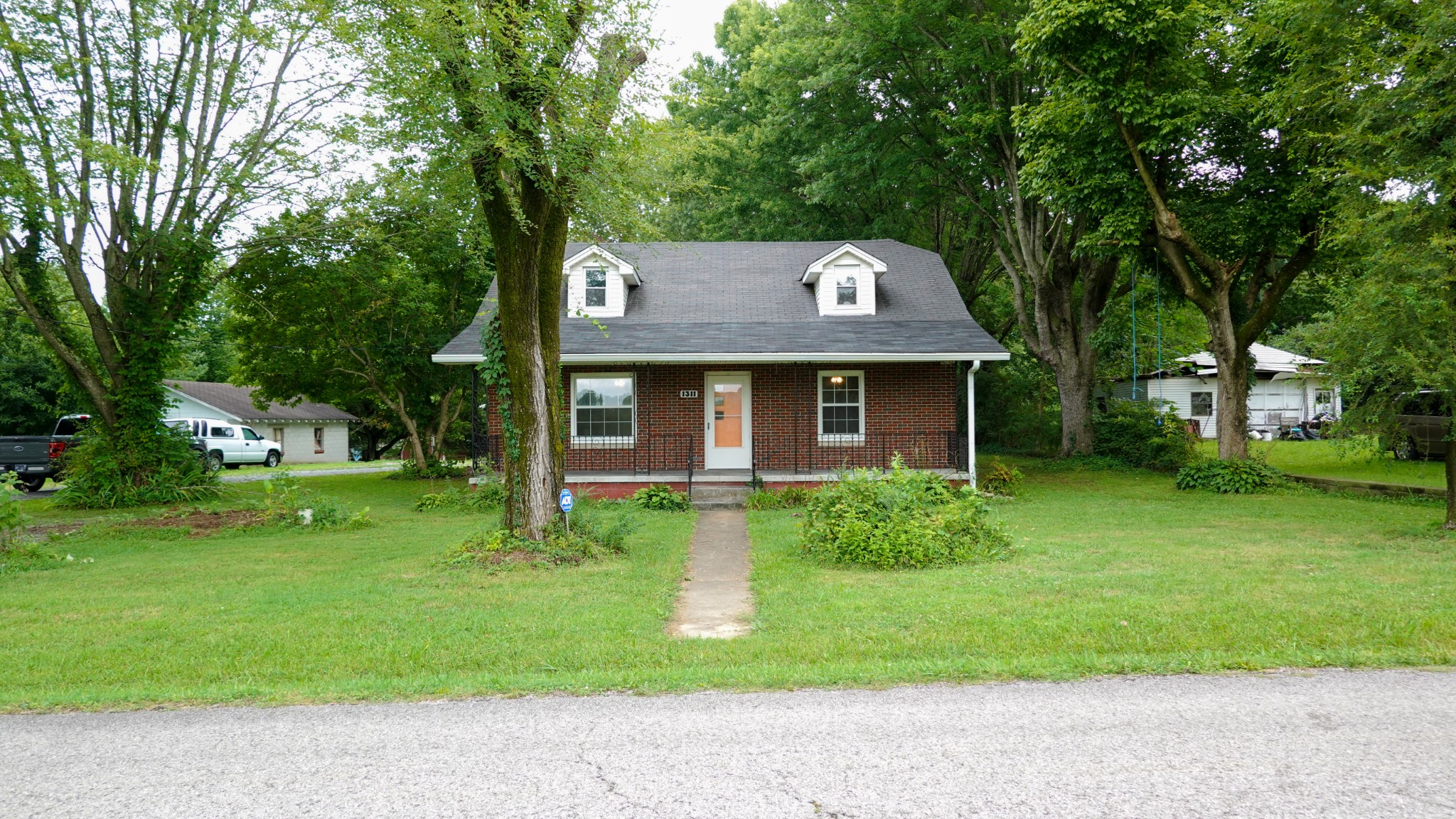 a front view of a house with a yard