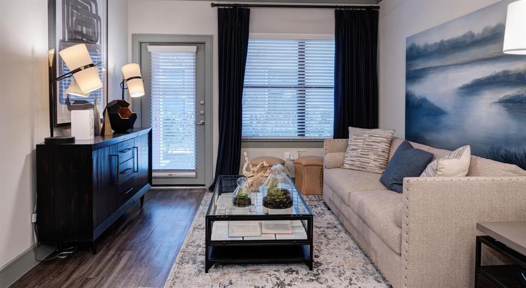 a living room with furniture fireplace and lamp