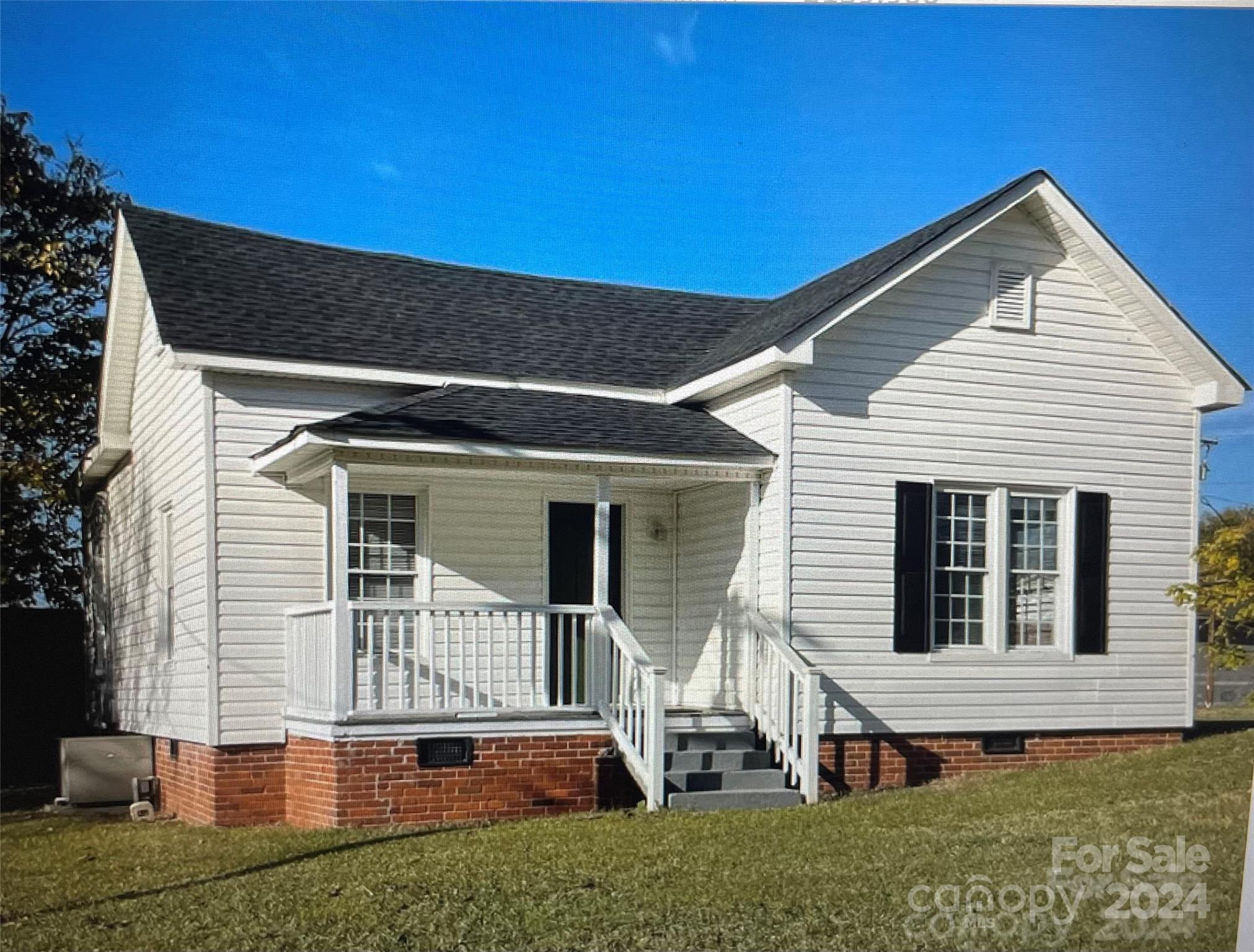 a view of house with backyard