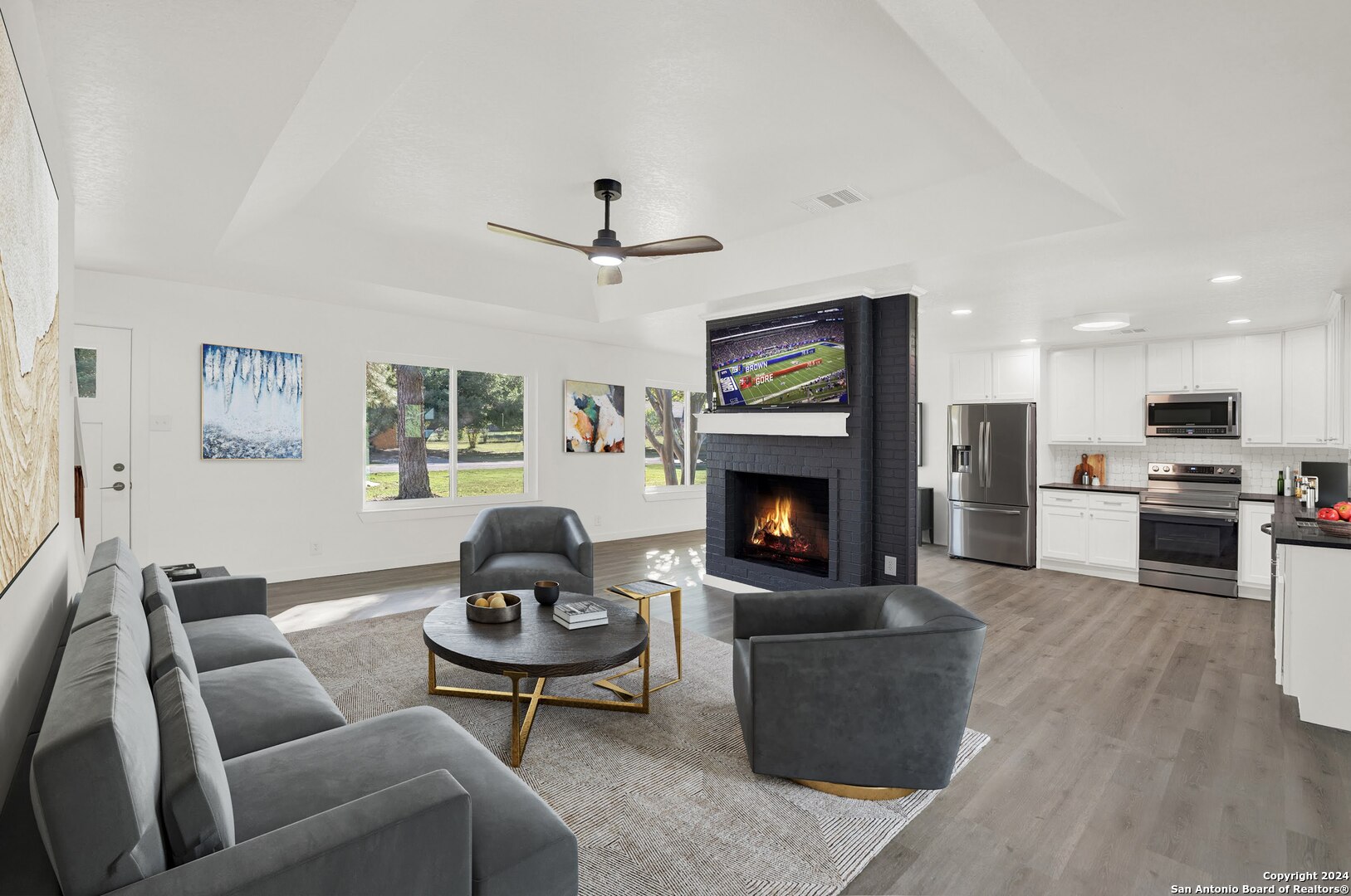 a living room with furniture and a fireplace