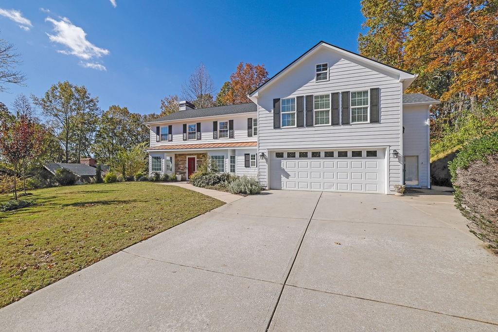 a front view of a house with a yard