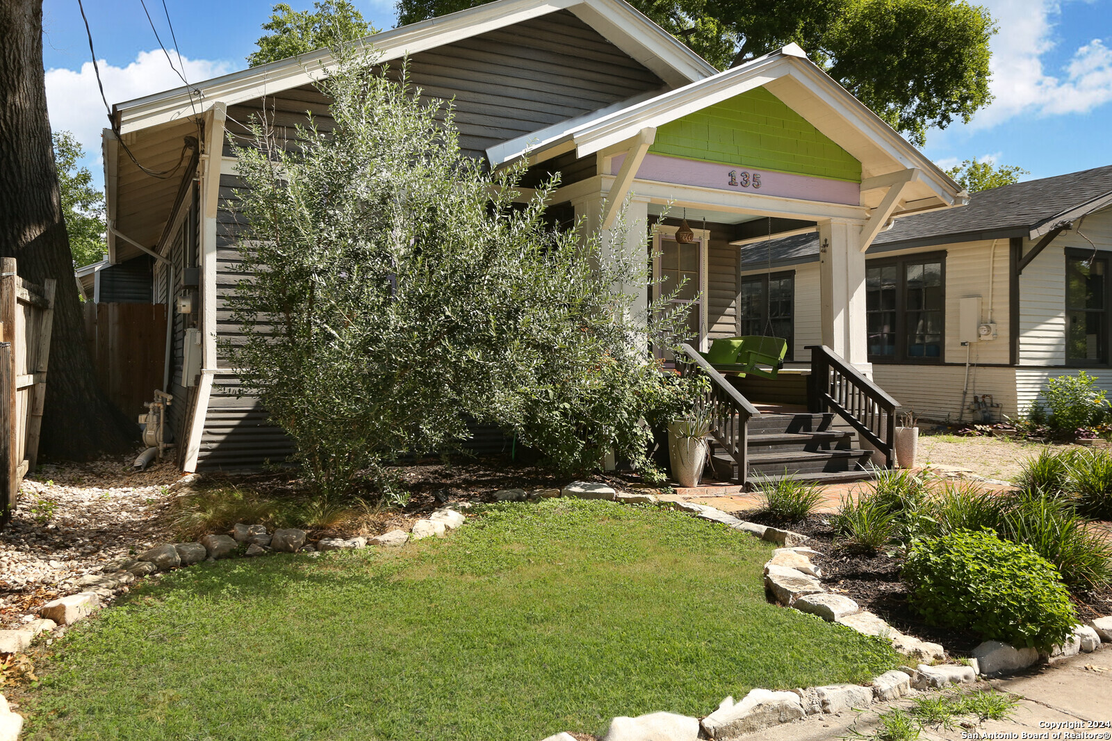 a front view of a house with garden