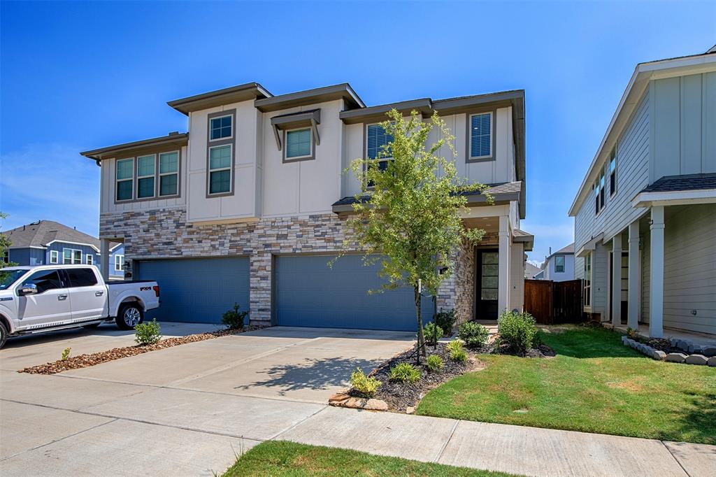 This charming three-bedroom townhome in the desirable Meridiana community offers both comfort and convenience. The front of the home features a beautiful stone elevation that adds to its curb appeal.