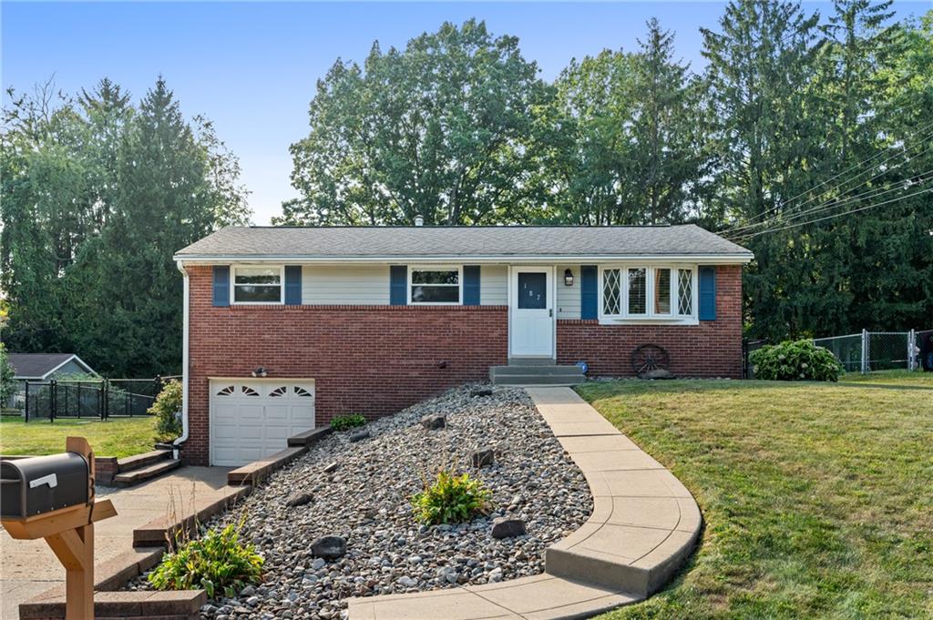 front view of a house with a yard