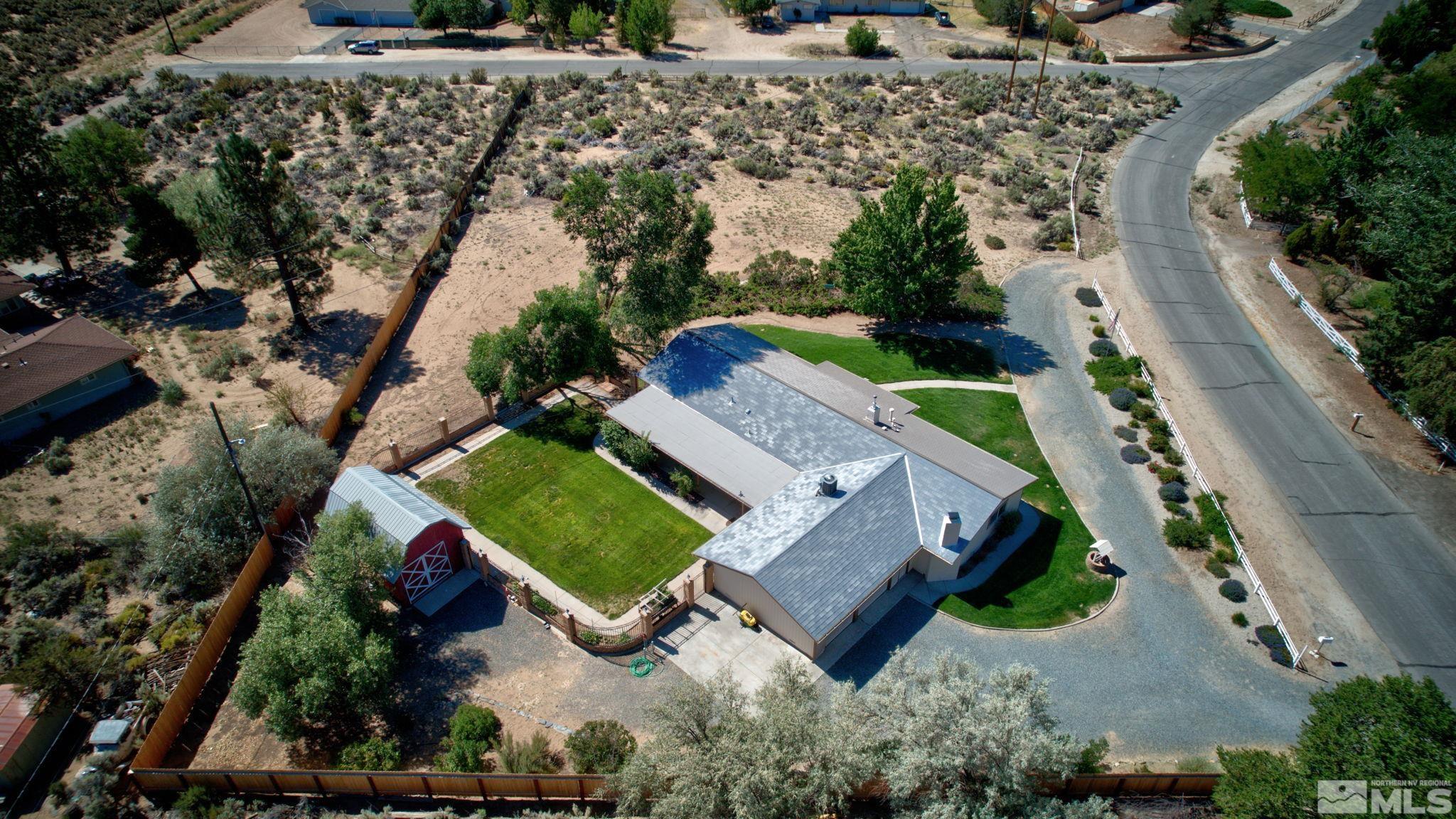 an aerial view of a house with outdoor space