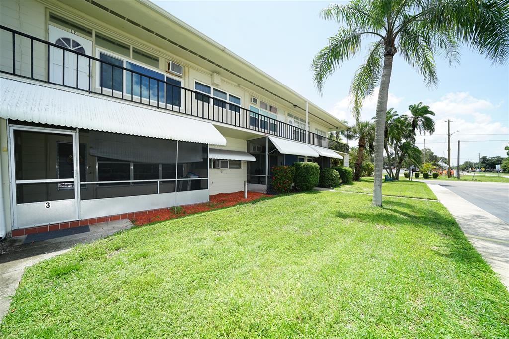 a view of house with yard and swimming pool