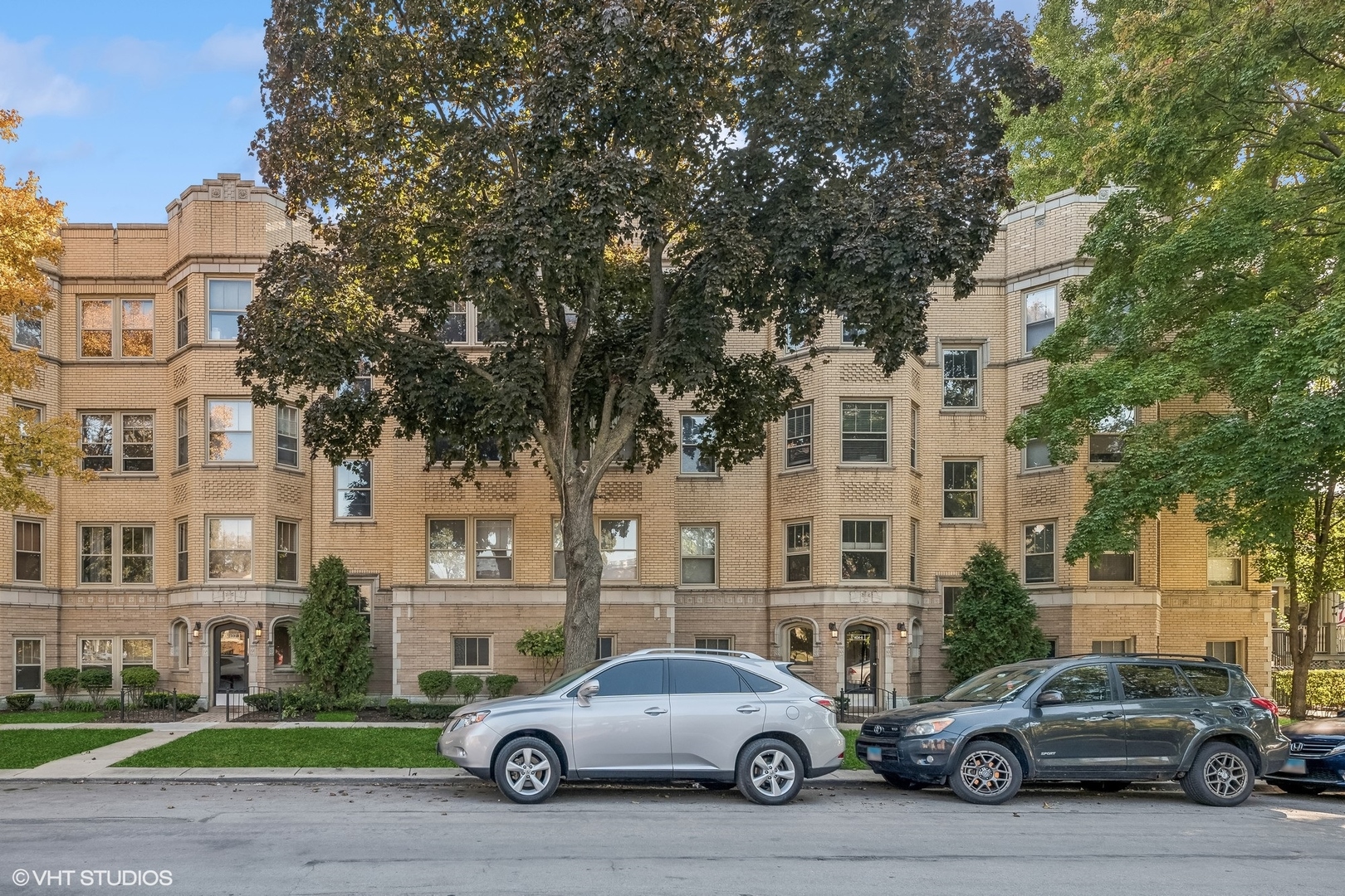 a car parked in front of a white building