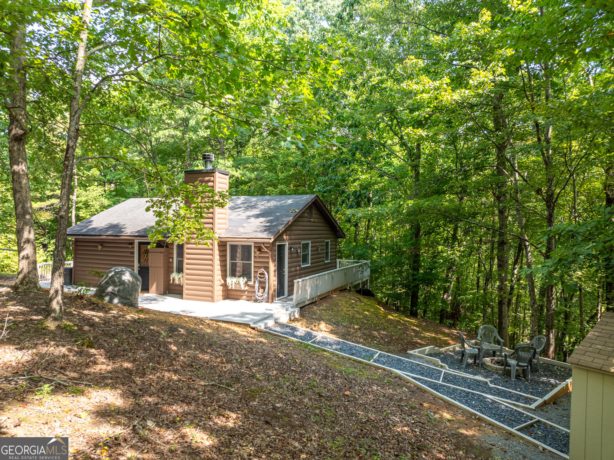 a house with trees in the background