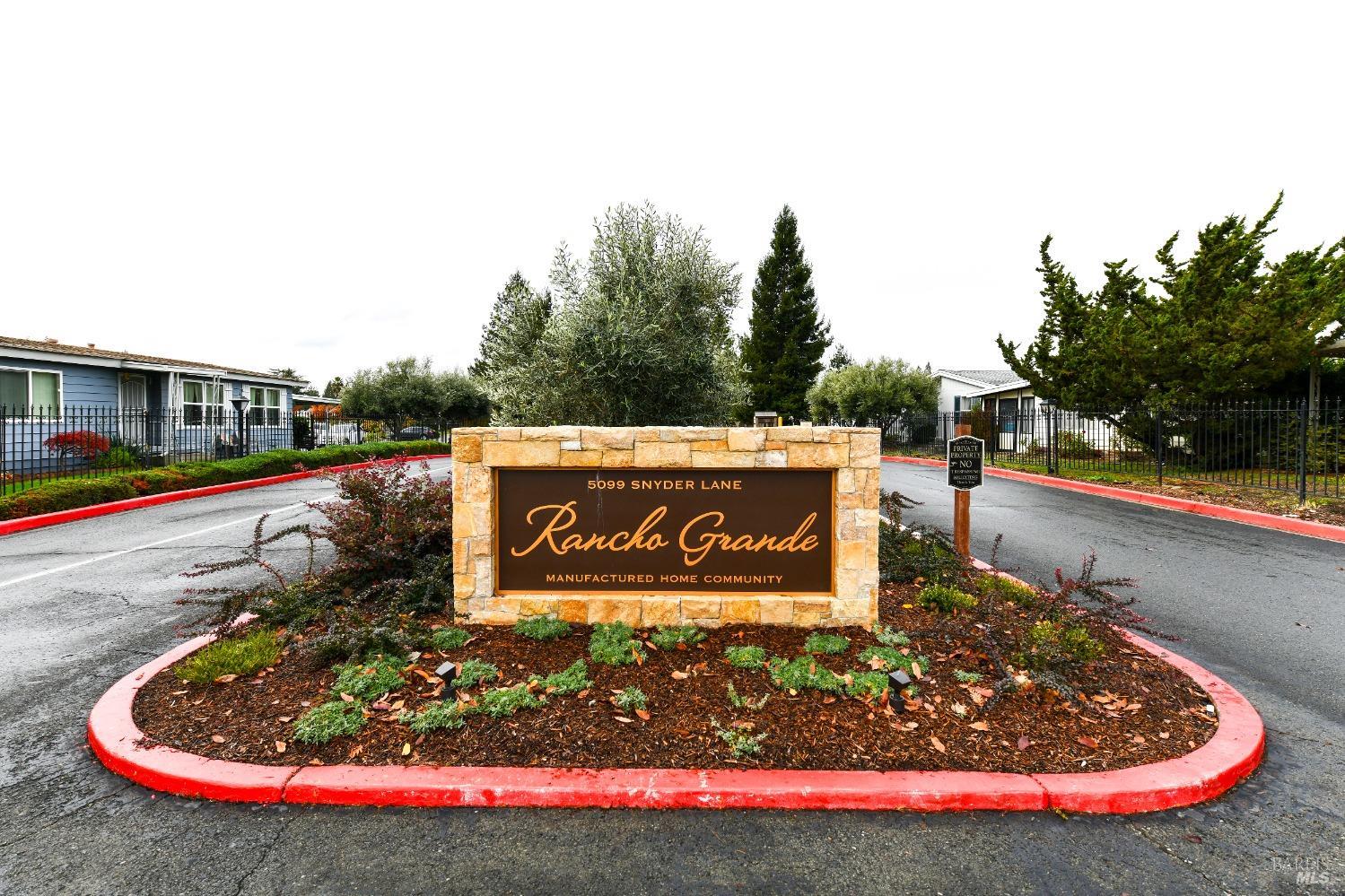 a view of outdoor space with signage and flags