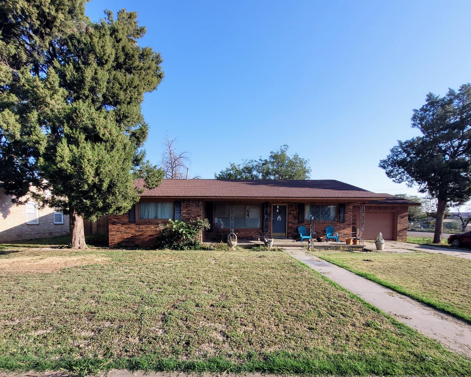 a front view of building with yard and green space