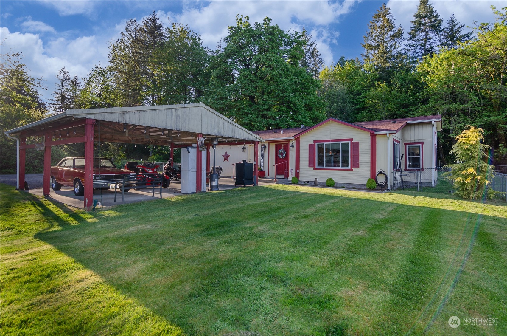 a view of a house with a backyard patio and swimming pool