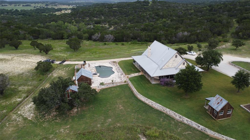 an aerial view of a house with outdoor space