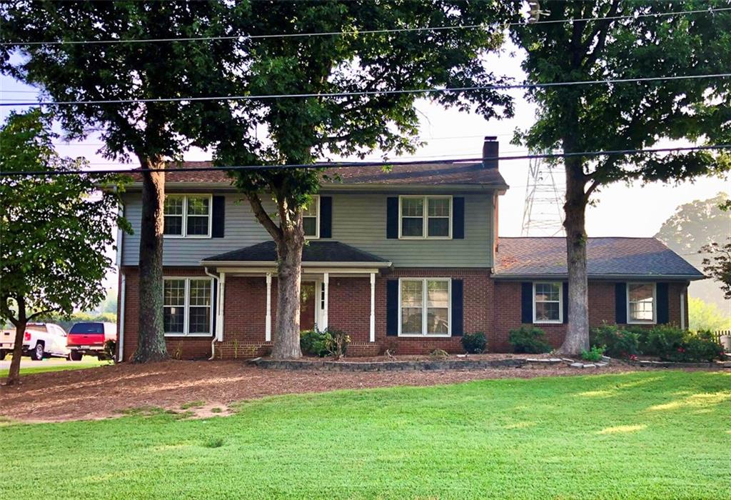 front view of a house with a yard