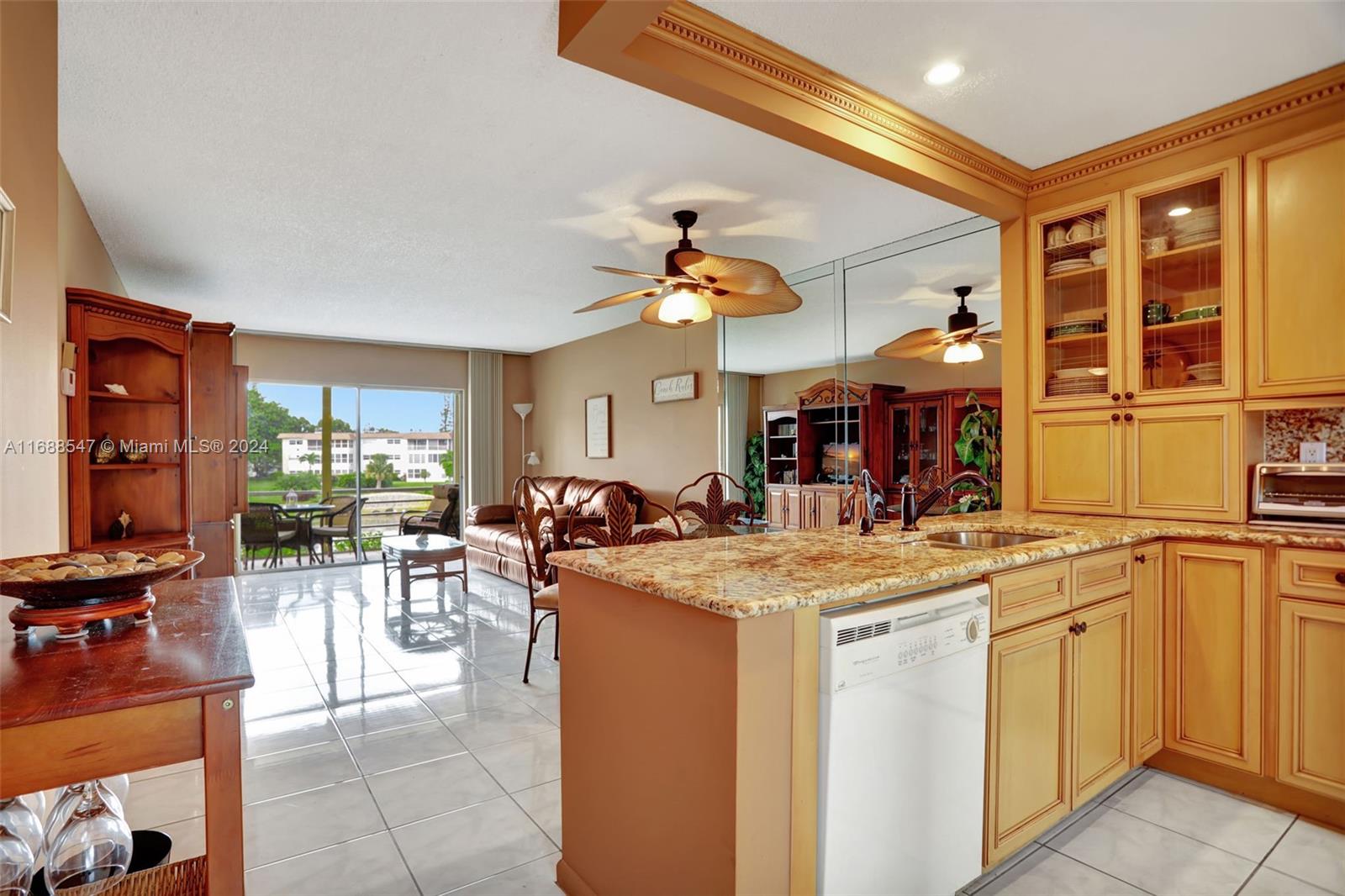 a view of a living room and kitchen view