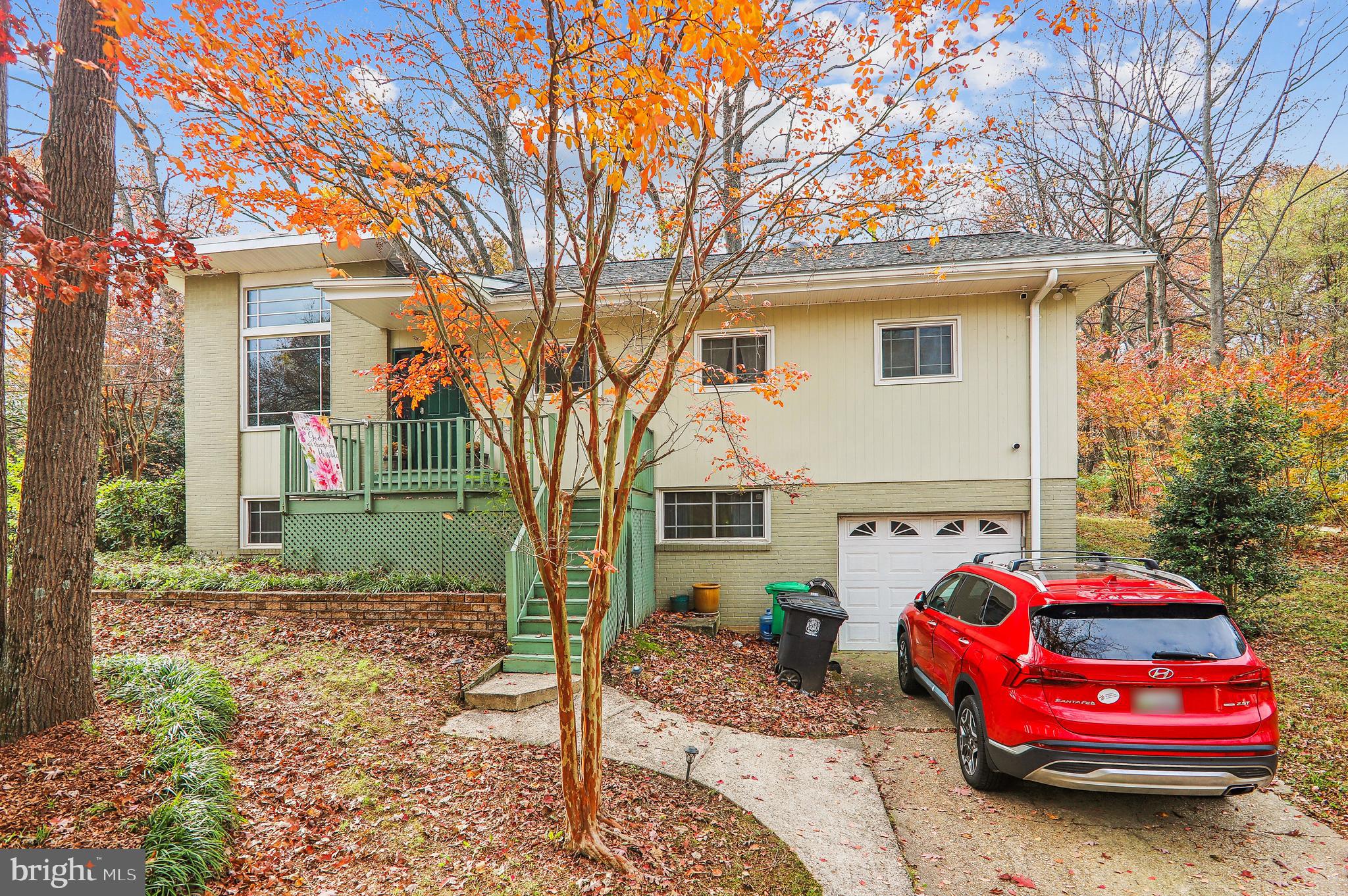 a front view of a house with parking