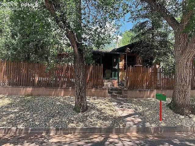 a backyard of a house with lots of tree