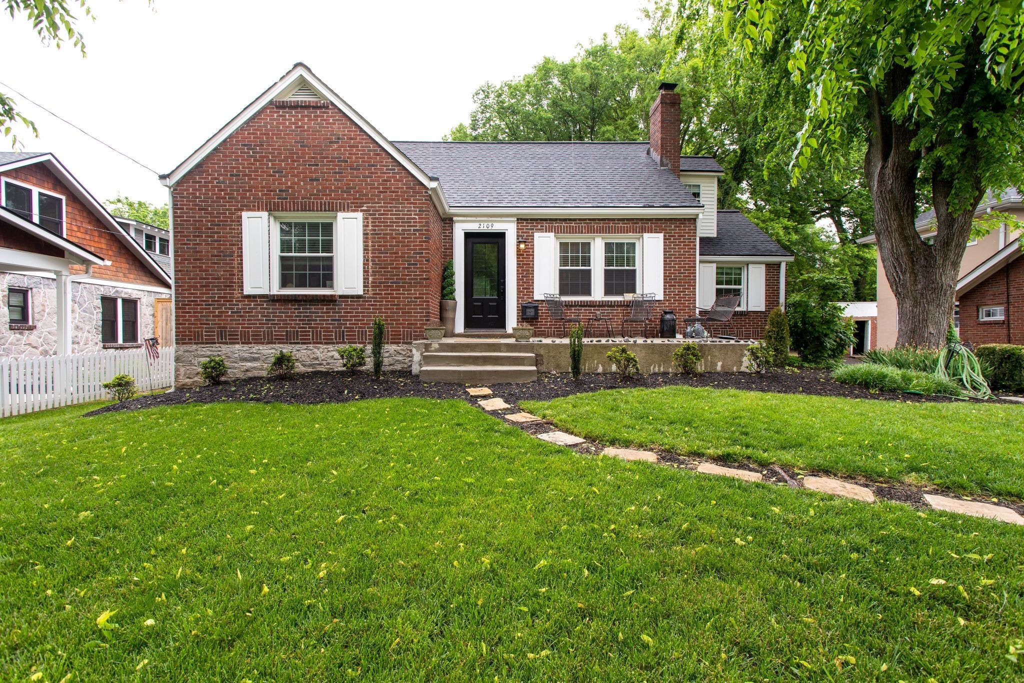 a front view of a house with a yard