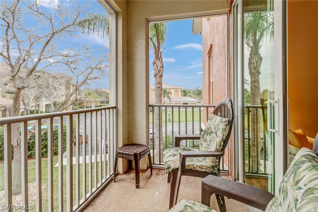 a view of a balcony with furniture