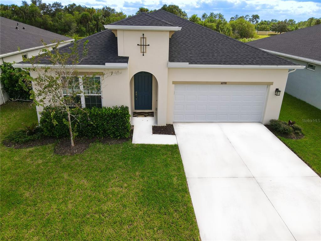 a front view of a house with a yard