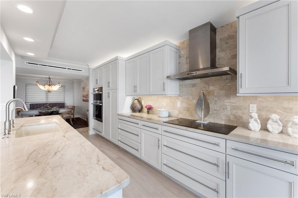 a kitchen with sink and cabinets