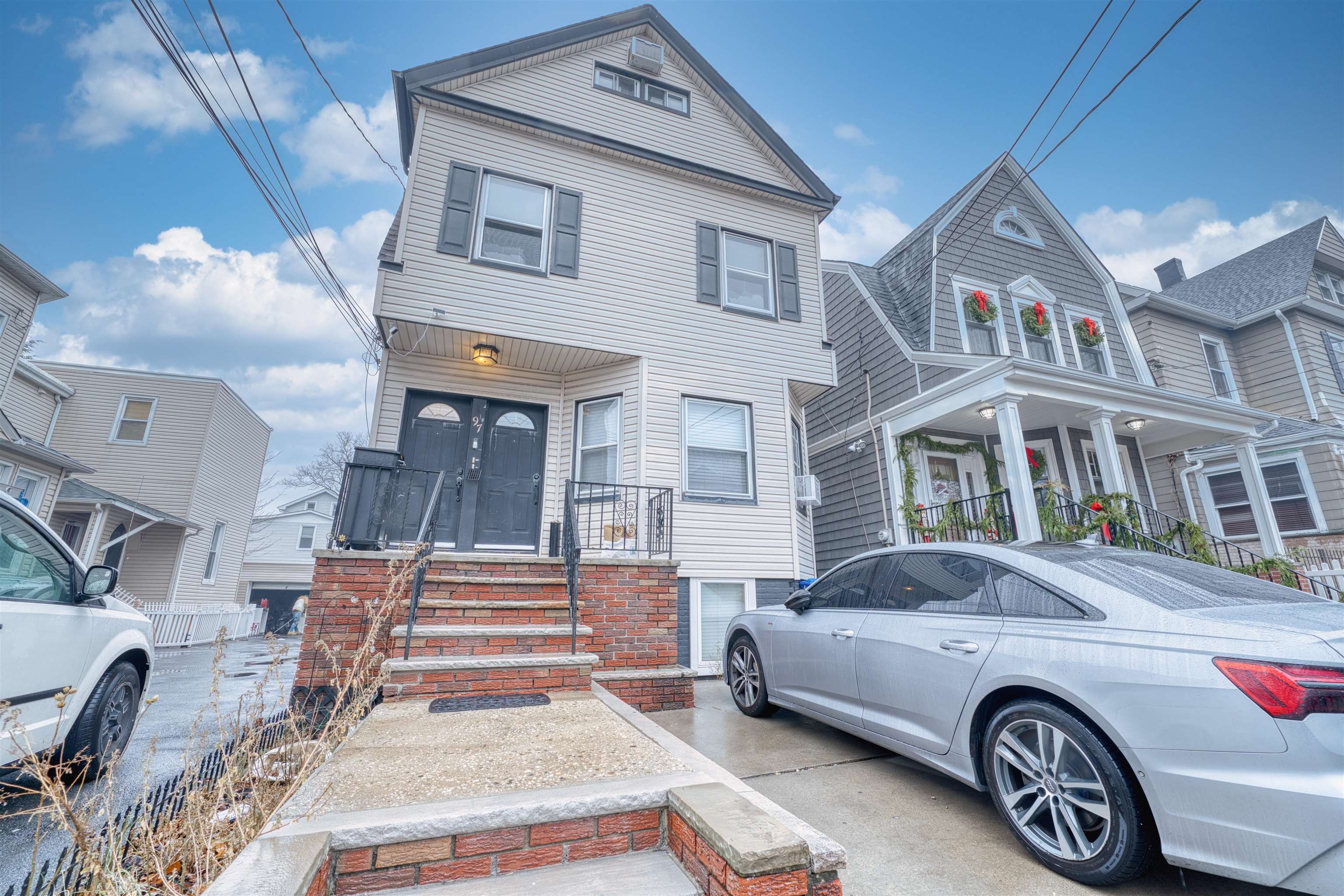 a front view of a house with parking space