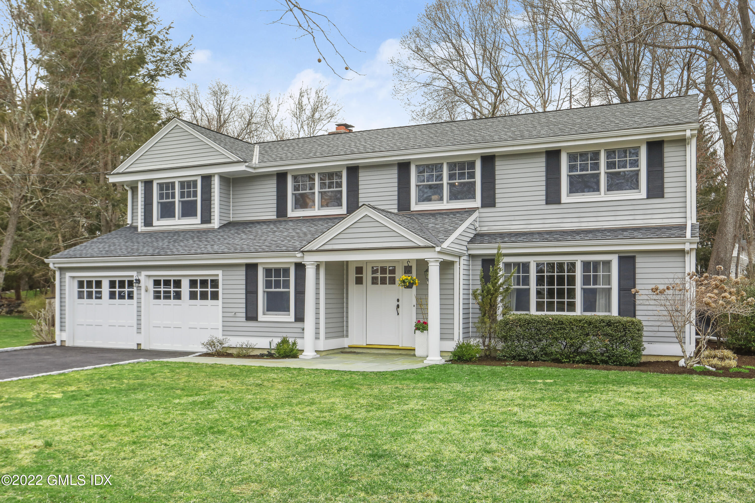 front view of a house with a yard