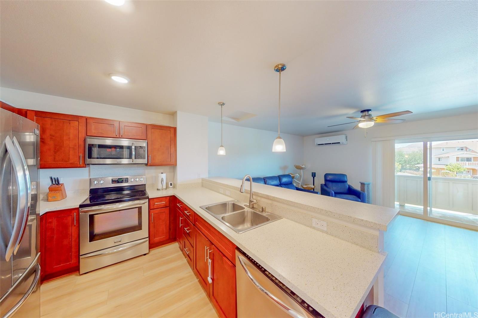 a kitchen with stainless steel appliances granite countertop a sink and a stove